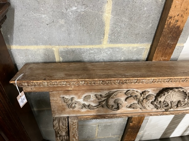 A Georgian carved pine fire surround, width 143cm, height 135cm (aperture width 96cm, height 105cm)